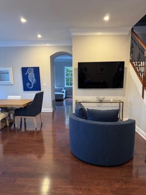 1913 Flower Dr, Palm Beach Gardens, FL 33410 - living room featuring arched walkways, crown molding, stairway, wood finished floors, and recessed lighting
