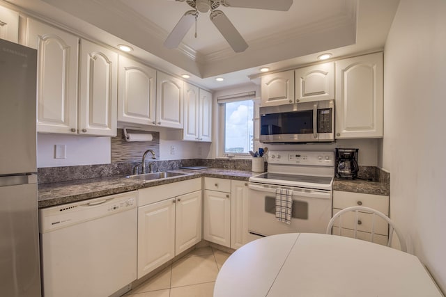 3221 S Ocean Blvd Unit 501, Highland Beach, FL 33487 - kitchen with stainless steel appliances, ornamental molding, a ceiling fan, dark countertops, and recessed lighting