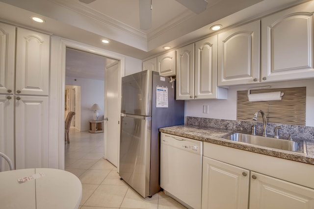 3221 S Ocean Blvd Unit 501, Highland Beach, FL 33487 - kitchen with white dishwasher, freestanding refrigerator, light tile patterned floors, crown molding, and recessed lighting