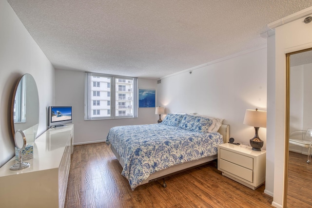 3221 S Ocean Blvd Unit 501, Highland Beach, FL 33487 - bedroom featuring wood finished floors and a textured ceiling
