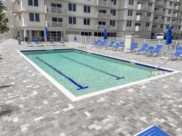 3221 S Ocean Blvd Unit 501, Highland Beach, FL 33487 - community pool featuring a patio