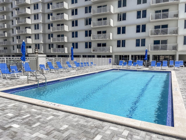 3221 S Ocean Blvd Unit 501, Highland Beach, FL 33487 - community pool featuring a patio area