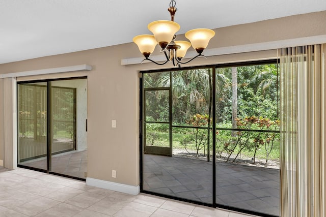 5610 Coach House Cir Unit C, Boca Raton, FL 33486 - doorway to outside with a chandelier, plenty of natural light, and light tile patterned floors