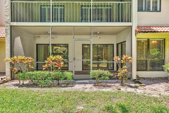 5610 Coach House Cir Unit C, Boca Raton, FL 33486 - view of exterior entry with a balcony, a ceiling fan, and stucco siding