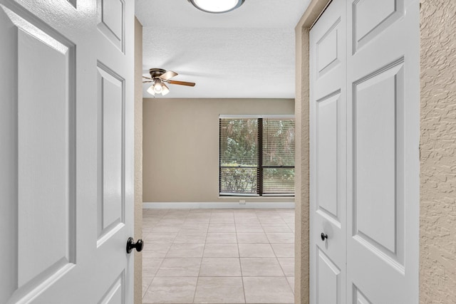 5610 Coach House Cir Unit C, Boca Raton, FL 33486 - unfurnished room with a textured ceiling, light tile patterned floors, and a ceiling fan