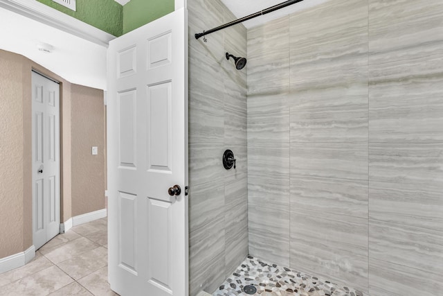 5610 Coach House Cir Unit C, Boca Raton, FL 33486 - full bath featuring tiled shower, a textured wall, and tile patterned flooring