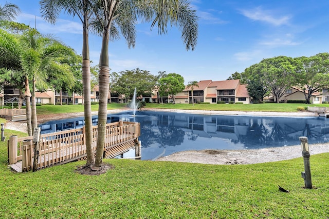 5610 Coach House Cir Unit C, Boca Raton, FL 33486 - view of pool with a lawn and a water view