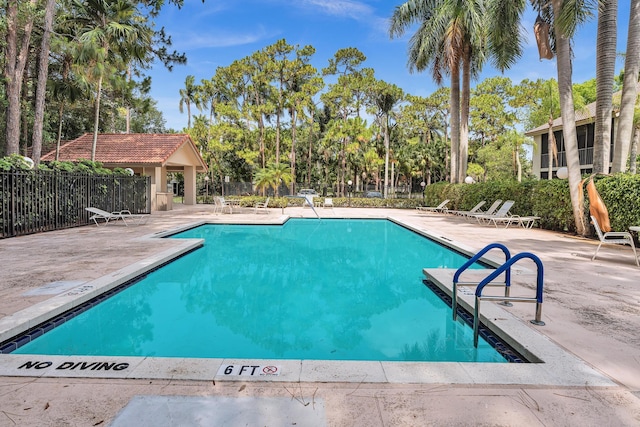5610 Coach House Cir Unit C, Boca Raton, FL 33486 - community pool with a patio and view of scattered trees