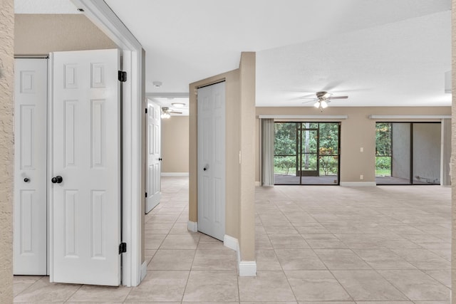 5610 Coach House Cir Unit C, Boca Raton, FL 33486 - corridor featuring light tile patterned flooring and baseboards