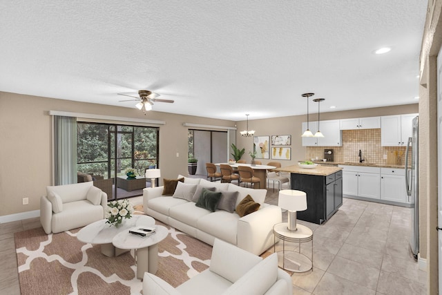 5610 Coach House Cir Unit C, Boca Raton, FL 33486 - living room featuring ceiling fan, a chandelier, a textured ceiling, and recessed lighting