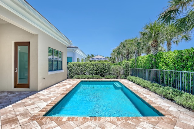 13501 Artisan Cir, Palm Beach Gardens, FL 33418 - view of pool with a fenced backyard and a patio