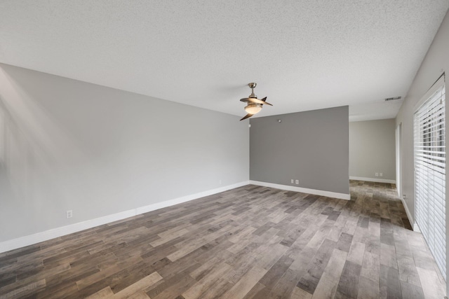 3665 Silver Lace Ln Unit 80, Boynton Beach, FL 33436 - unfurnished room featuring ceiling fan, dark wood-type flooring, and a textured ceiling