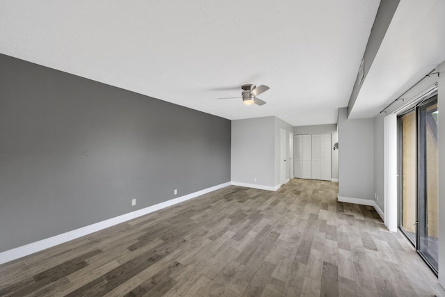 3665 Silver Lace Ln Unit 80, Boynton Beach, FL 33436 - empty room featuring a ceiling fan and wood finished floors