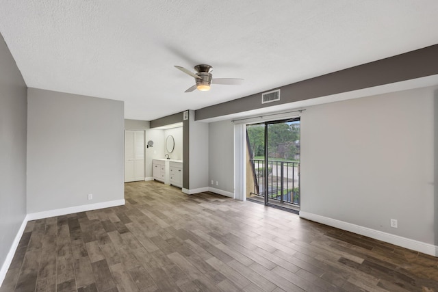 3665 Silver Lace Ln Unit 80, Boynton Beach, FL 33436 - unfurnished room with ceiling fan, wood finished floors, and a textured ceiling