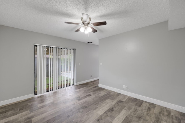 3665 Silver Lace Ln Unit 80, Boynton Beach, FL 33436 - empty room featuring ceiling fan, wood finished floors, and a textured ceiling