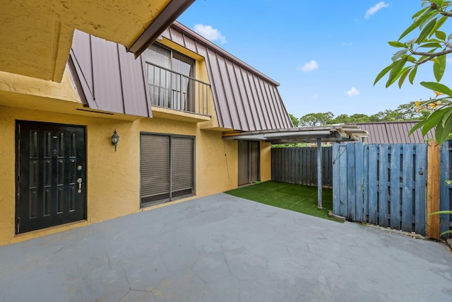 3665 Silver Lace Ln Unit 80, Boynton Beach, FL 33436 - back of house with a patio area, stucco siding, a balcony, and board and batten siding