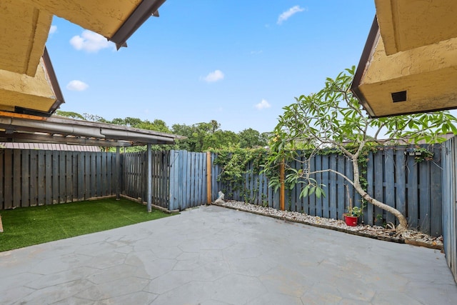 3665 Silver Lace Ln Unit 80, Boynton Beach, FL 33436 - fenced backyard featuring a patio area