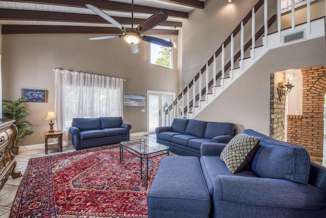 130 S Ocean Breeze, Lake Worth Beach, FL 33460 - living area featuring ceiling fan, a towering ceiling, stairway, and a wood ceiling with exposed beams