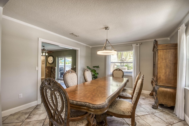 130 S Ocean Breeze, Lake Worth Beach, FL 33460 - dining room with crown molding and a textured ceiling