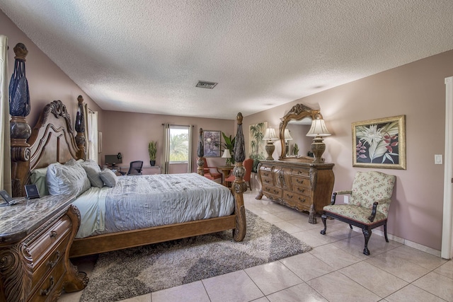 130 S Ocean Breeze, Lake Worth Beach, FL 33460 - bedroom featuring a textured ceiling and light tile patterned flooring