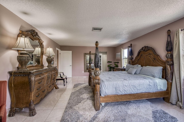 130 S Ocean Breeze, Lake Worth Beach, FL 33460 - bedroom with a textured ceiling and light tile patterned flooring