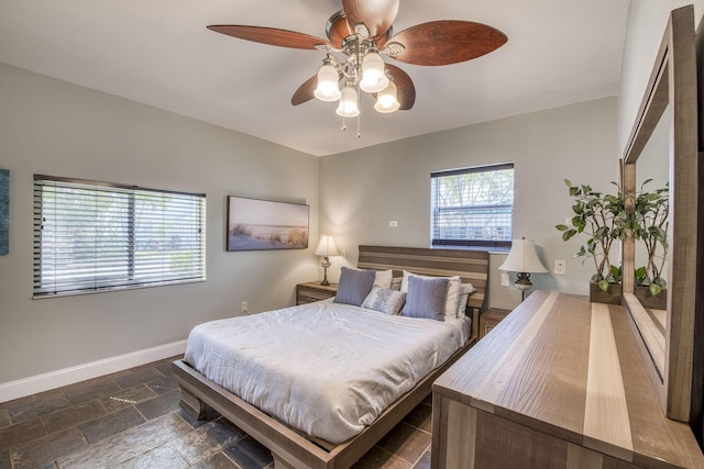 130 S Ocean Breeze, Lake Worth Beach, FL 33460 - bedroom featuring stone tile flooring and ceiling fan