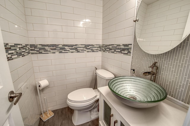 130 S Ocean Breeze, Lake Worth Beach, FL 33460 - half bathroom with tile walls and wood finished floors
