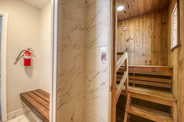 130 S Ocean Breeze, Lake Worth Beach, FL 33460 - sauna featuring wood ceiling, wooden walls, and marble look tiles