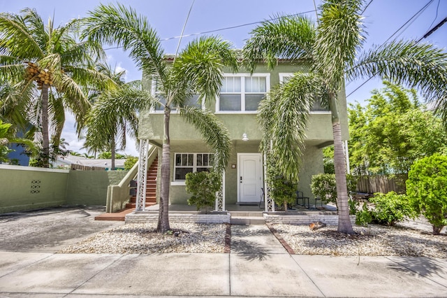 130 S Ocean Breeze, Lake Worth Beach, FL 33460 - view of front of home featuring stucco siding and covered porch