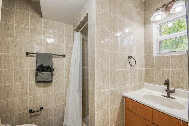 130 S Ocean Breeze, Lake Worth Beach, FL 33460 - bathroom with tile walls, vanity, and tiled shower