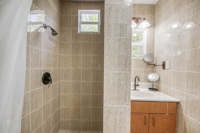 130 S Ocean Breeze, Lake Worth Beach, FL 33460 - full bathroom featuring tiled shower, vanity, and tile walls