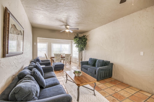 130 S Ocean Breeze, Lake Worth Beach, FL 33460 - living room with a textured wall, ceiling fan, light tile patterned flooring, and a textured ceiling