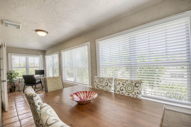 130 S Ocean Breeze, Lake Worth Beach, FL 33460 - dining space featuring a textured ceiling
