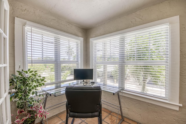 130 S Ocean Breeze, Lake Worth Beach, FL 33460 - home office with a textured wall and tile patterned flooring