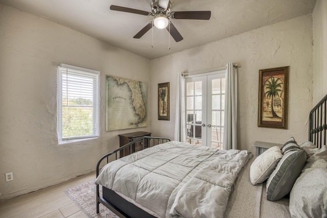 130 S Ocean Breeze, Lake Worth Beach, FL 33460 - bedroom featuring french doors, a textured wall, wood finished floors, ceiling fan, and access to outside