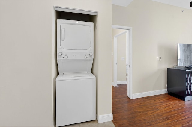 233 S Federal Hwy Unit Uph04, Boca Raton, FL 33432 - laundry room with stacked washer and clothes dryer and wood finished floors
