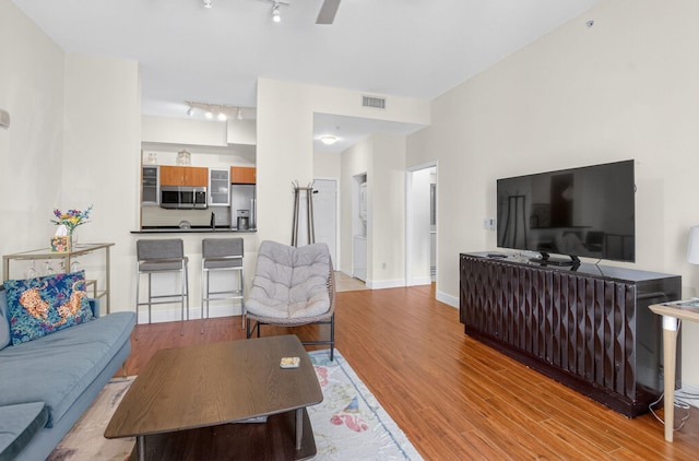 233 S Federal Hwy Unit Uph04, Boca Raton, FL 33432 - living room featuring rail lighting and wood finished floors