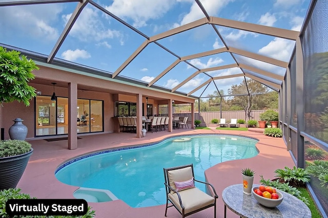 2774 SE Howell Ave, Port Saint Lucie, FL 34952 - view of pool with a patio area, outdoor dining area, and a lanai