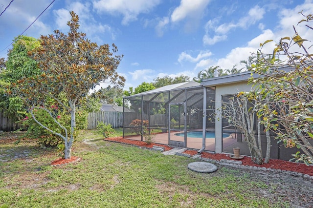 2774 SE Howell Ave, Port Saint Lucie, FL 34952 - fenced backyard featuring glass enclosure and a patio area