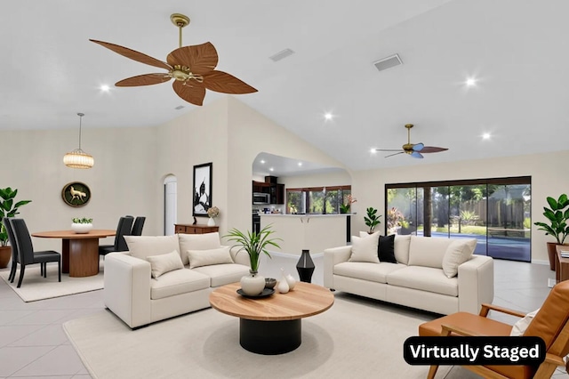 2774 SE Howell Ave, Port Saint Lucie, FL 34952 - living room with ceiling fan, light tile patterned floors, recessed lighting, and high vaulted ceiling