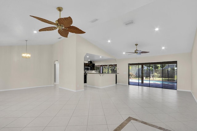 2774 SE Howell Ave, Port Saint Lucie, FL 34952 - unfurnished living room featuring a ceiling fan, light tile patterned floors, recessed lighting, high vaulted ceiling, and a chandelier