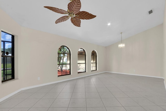 2774 SE Howell Ave, Port Saint Lucie, FL 34952 - unfurnished room featuring vaulted ceiling, light tile patterned floors, ceiling fan, and a chandelier