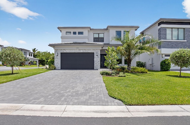 8516 Swinley Forest Way, Boca Raton, FL 33434 - view of front of house with decorative driveway, a front lawn, a garage, and stucco siding