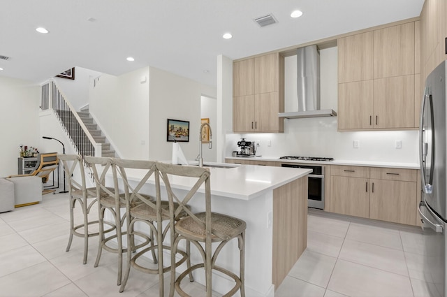 8516 Swinley Forest Way, Boca Raton, FL 33434 - kitchen featuring light brown cabinetry, oven, wall chimney range hood, freestanding refrigerator, and recessed lighting