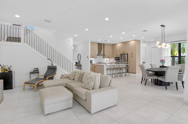 8516 Swinley Forest Way, Boca Raton, FL 33434 - living room with recessed lighting, stairs, light tile patterned floors, and a chandelier
