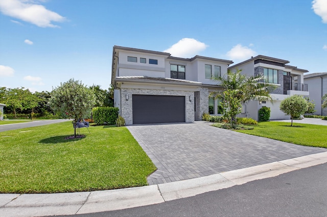 8516 Swinley Forest Way, Boca Raton, FL 33434 - contemporary home featuring stucco siding, driveway, a front yard, and a garage