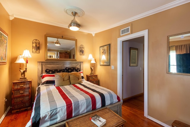 1016 N E St, Lake Worth Beach, FL 33460 - bedroom with ornamental molding and wood finished floors