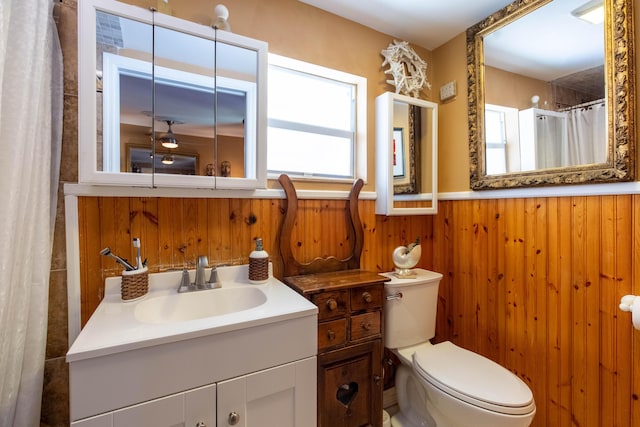 1016 N E St, Lake Worth Beach, FL 33460 - full bathroom featuring a wainscoted wall, vanity, wood walls, and a shower with curtain