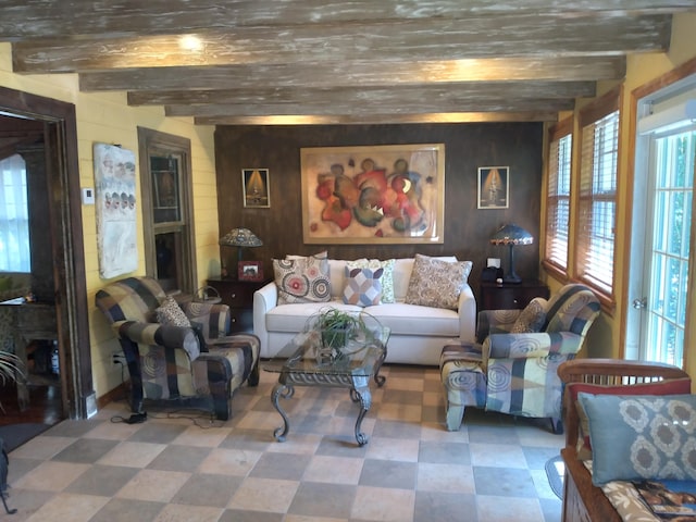 1016 N E St, Lake Worth Beach, FL 33460 - living area with tile patterned floors, wooden walls, and beam ceiling