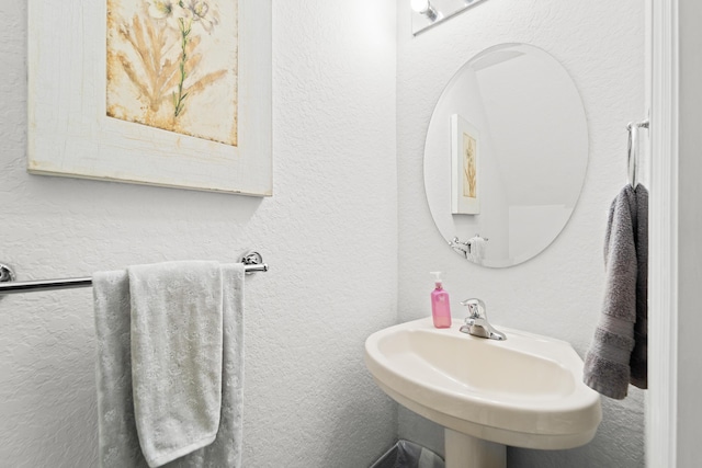 1947 Gardenia Ct, Riviera Beach, FL 33404 - bathroom with a textured wall and a sink